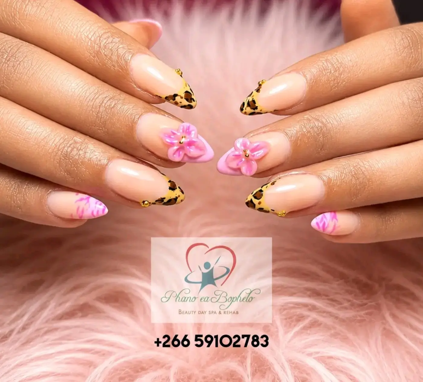 Floral and leopard-tip nail art by Phano ea Bophelo